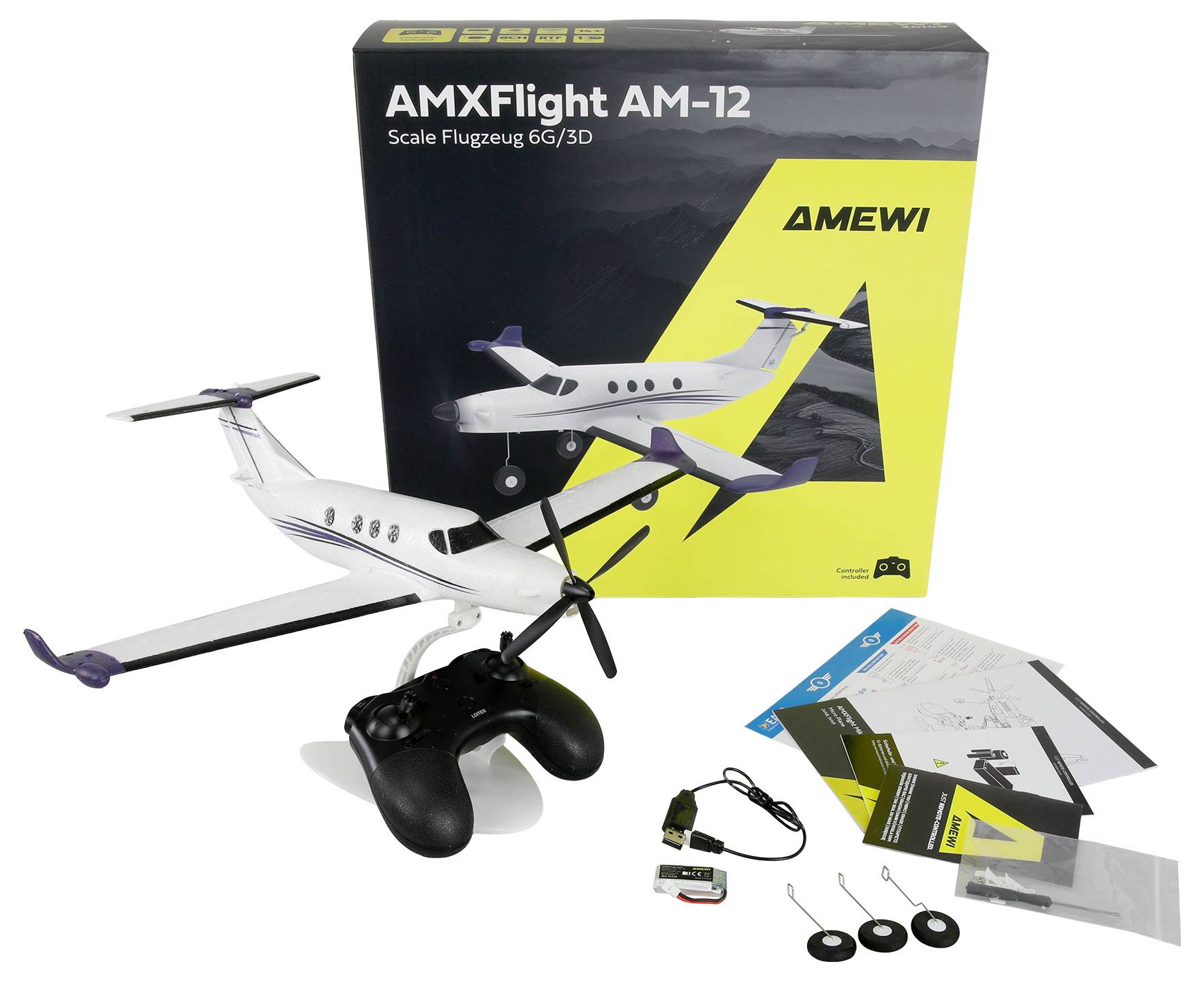Modelflygkit för en AMXFlight AM-12 jet med handkontroll, instruktionsböcker, batteri och tillbehör bredvid produktlådan.