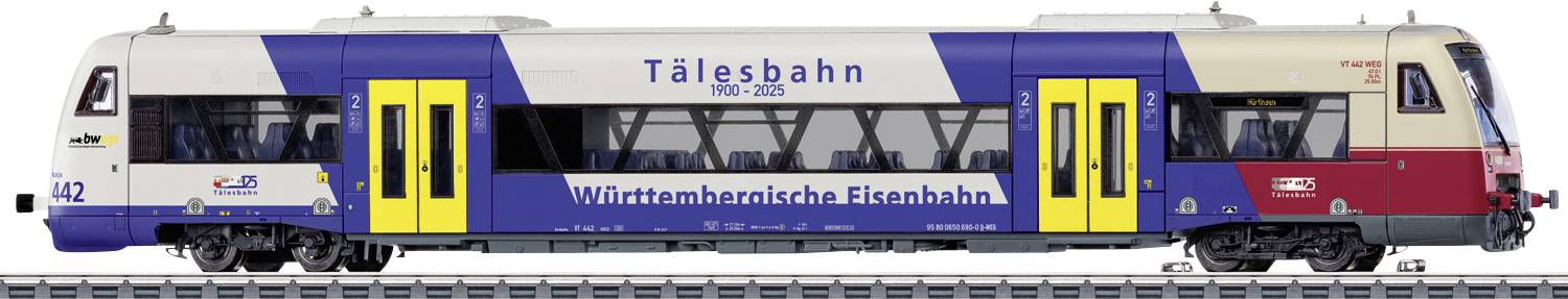 Sidovy av ett Talgo-passagerarståg i blå, vit och röd lackering med gula dörrar, märkt "Tålesbahn" och "Württembergische Eisenbahn."