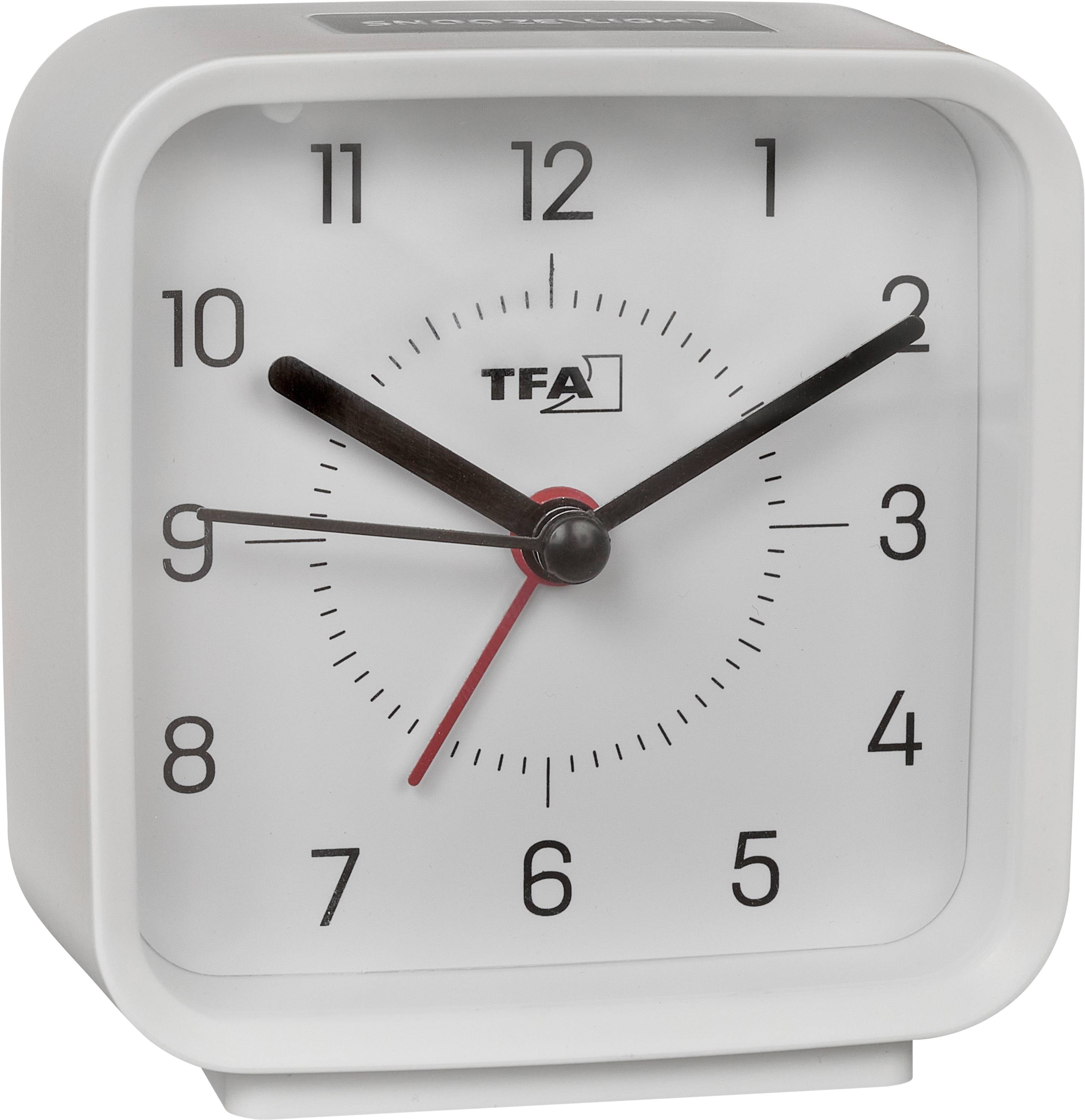 Vit analog väckarklocka med TFA-logotyp, visar cirka 10:10 med en röd sekundvisare.