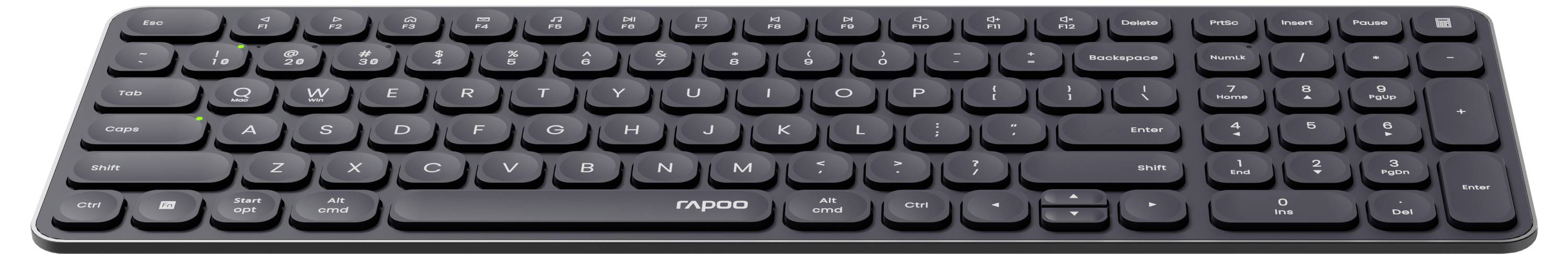 Ett svart trådlöst tangentbord i full storlek med låga tangenter och en numerisk knappsats, visad från ovan.