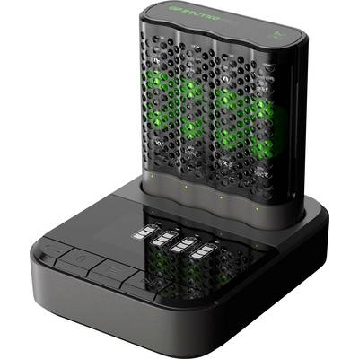 Svart digital väckarklocka med grön LED-display och fyra knappar på toppen, visad på en laddningsbas.