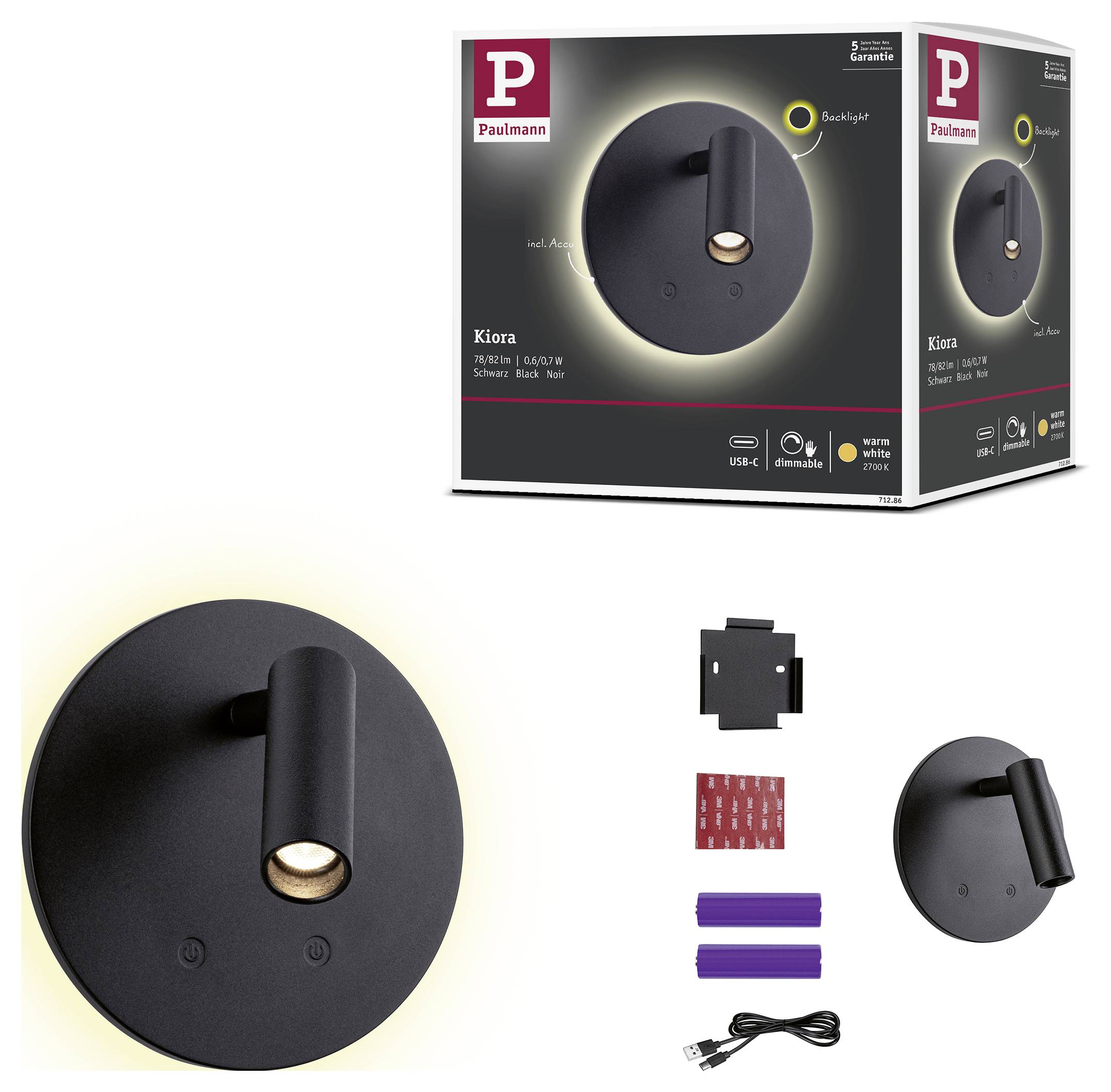 Produktbild av en svart Paulmann Kiora vägglampa med lysande halo, visad tillsammans med förpackning och ingående monteringsdelar, USB-C-kabel och tillbehör.