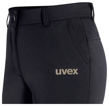 Närbild på svarta uvex-byxor eller arbetskläder som visar midjeband, blixtlåsöppning och logotype på låret.