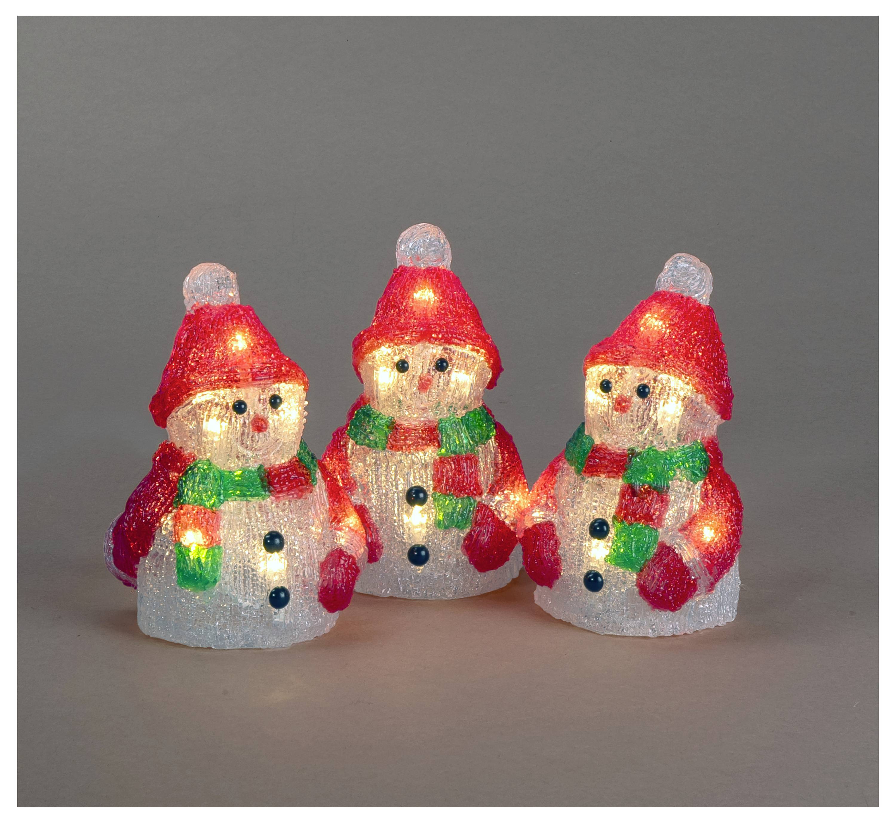 Tre upplysta snögubbe-juldekorationer med röda hattar och gröna sjalar på en grå bakgrund.