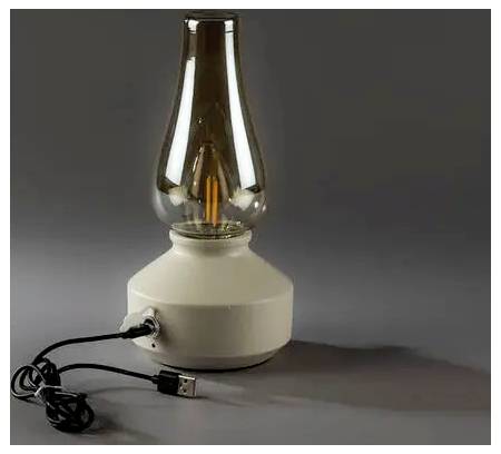 Oljeledasty vintage-stilad USB-lampa med klar glaskupa, beigefärgad bas och ansluten USB-kabel på grå bakgrund.