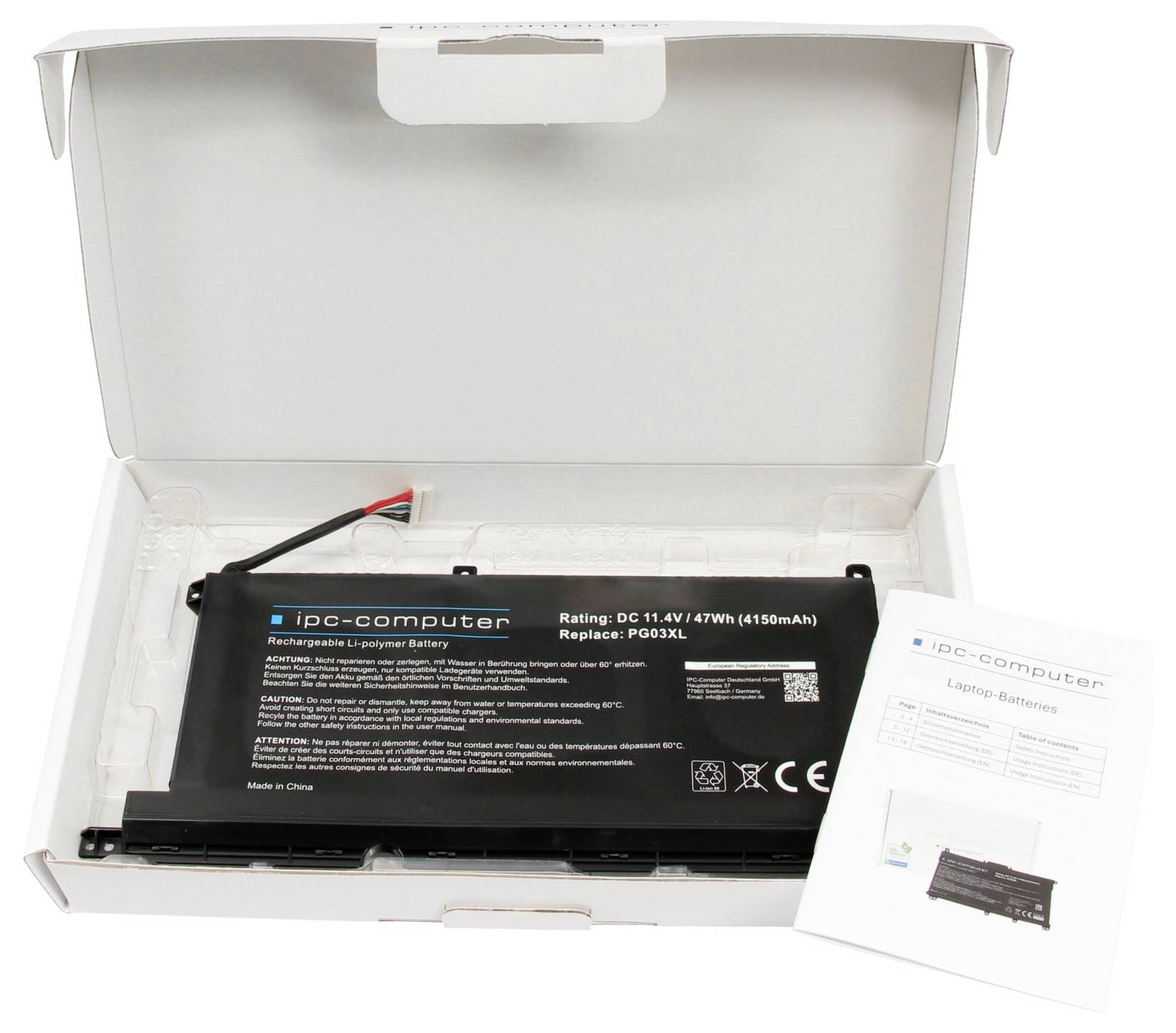 Öppen kartongask innehållande ett svart IPC-datorbatterium för uppladdningsbar bärbar dator med röd-svart kabel och en instruktionsbroschyr.