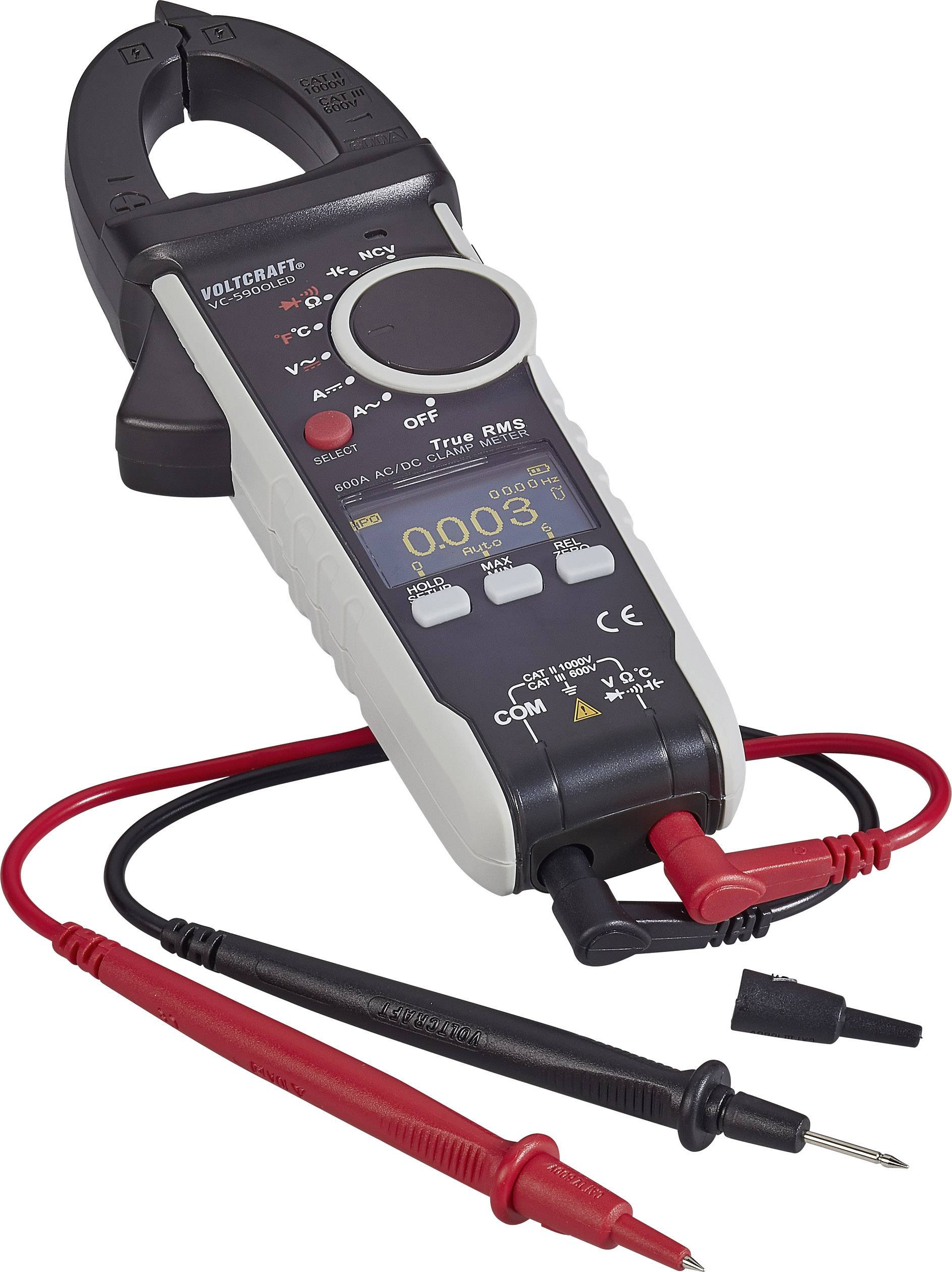 Digitalt multimeter med display som visar '0,083', mätledningar anslutna. Svarta klämman är öppna, redo för strömmätning.