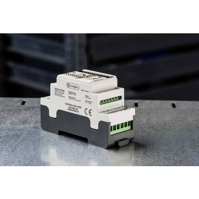 Ett elektroniskt styrsystem med flera anslutningar och CE-märkning, placerat på en metallyta.