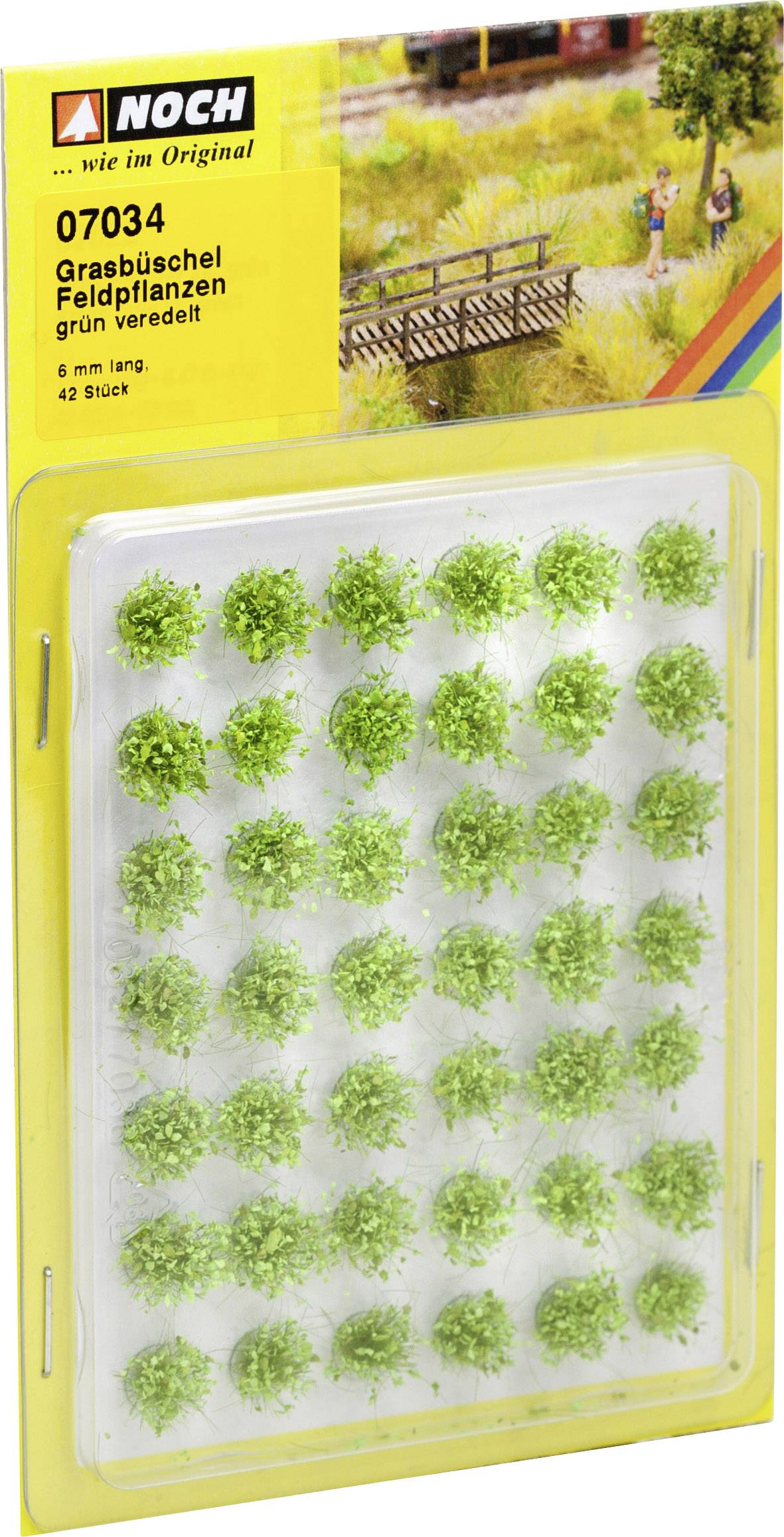 Förpackning med 42 små gröna grästuvor för dekoration av modellandskap. Märke: Noch.