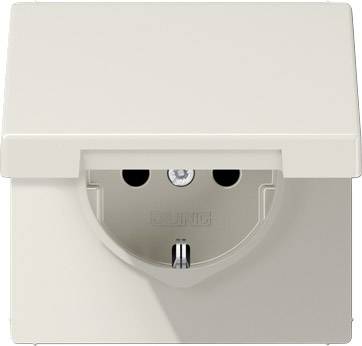 Vägguttag med lock i beige färg.