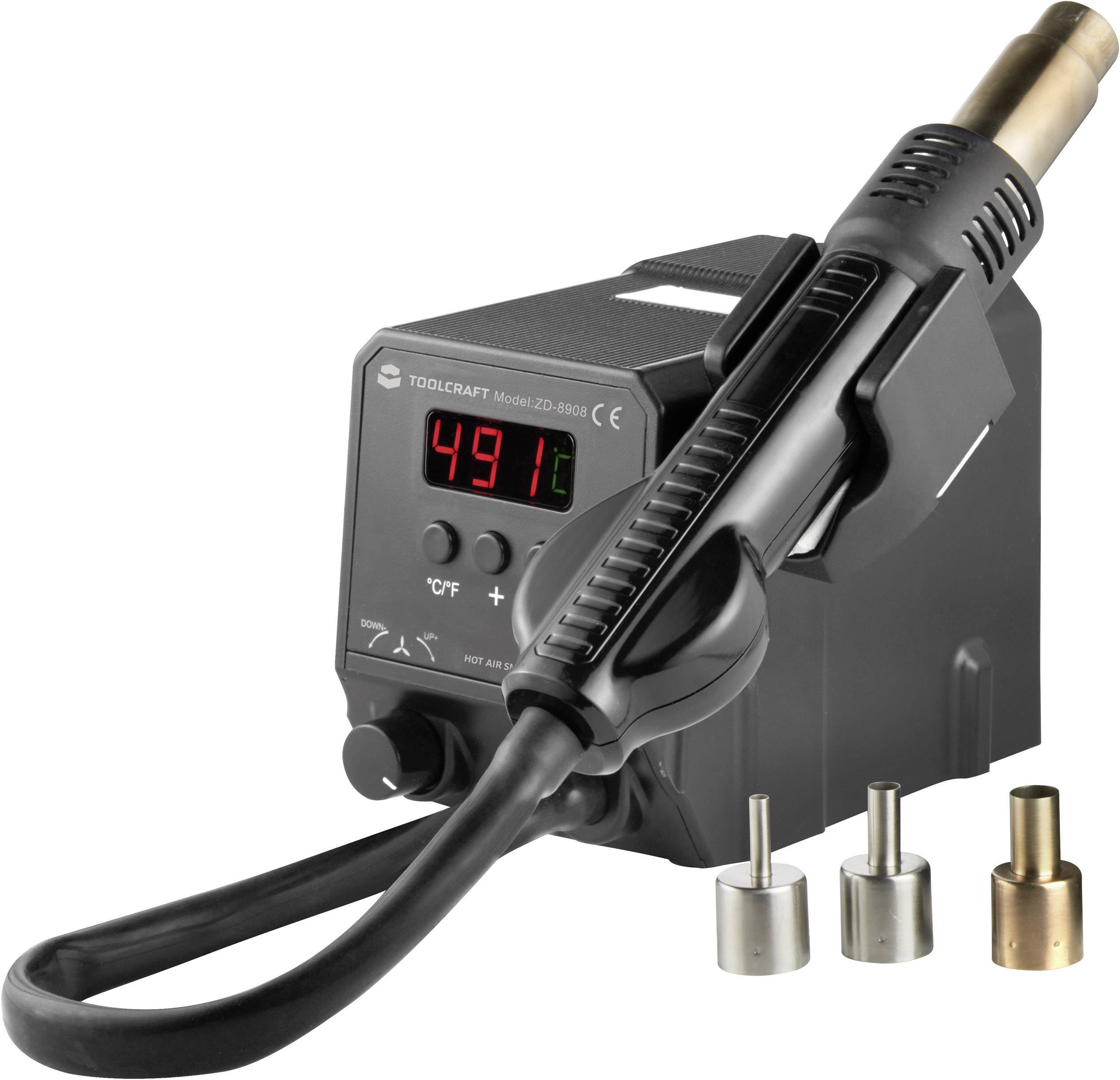 Värmepistol med digital temperaturvisning, inställd på 491 grader. Tre olika munstycken ligger bredvid.