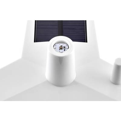 Vit teknologienhet med synligt solpanel och sensorer på ovansidan, utformad för solapplikationer utomhus.