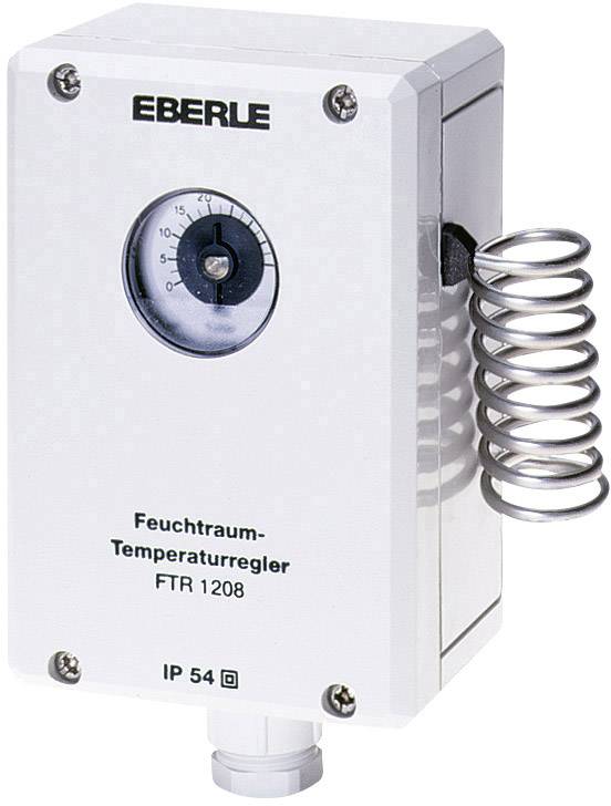 En vit fuktutrymmes-temperaturregulator med påskriften 'Eberle' och 'FTR 1208', bredvid en metallspiral, visar temperaturangivelsen.