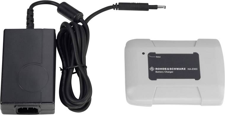 Batteriladdare med två komponenter: svart nätadapter med kabel och vit batteriladdare märkt med 'Rohde & Schwarz - HU-2203'.