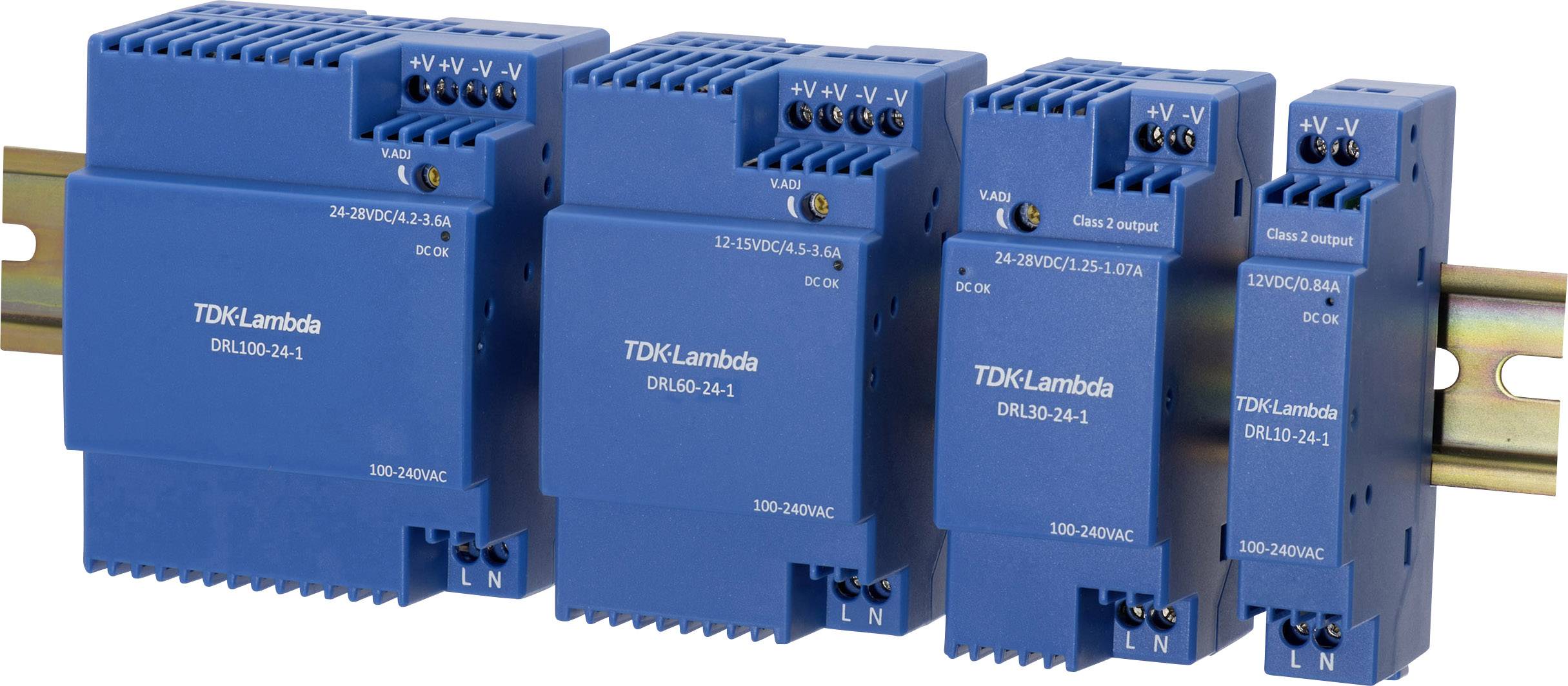 Blå industriell strömförsörjning från TDK-Lambda monterad på en skena, visar flera modeller med anslutningskontakter och spänningsvärden.