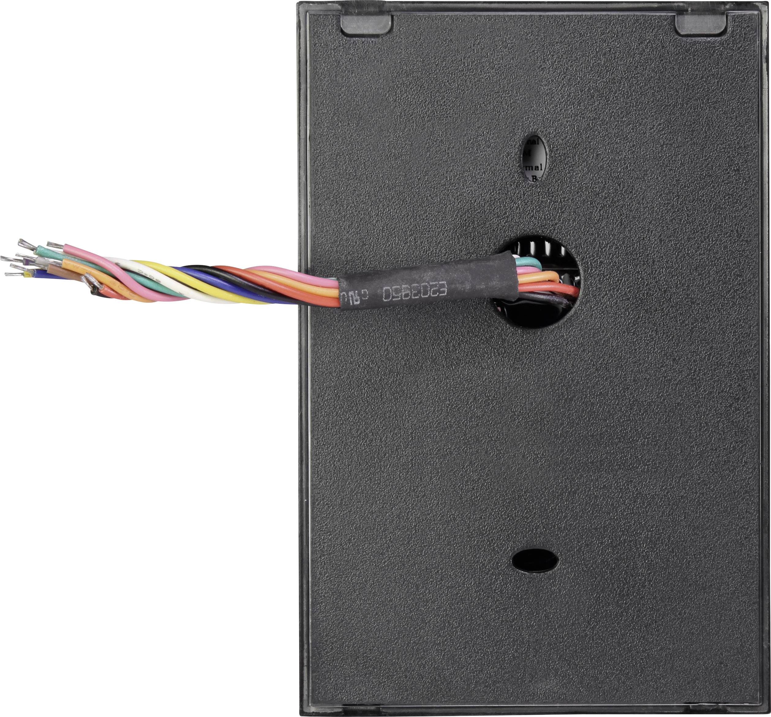En svart elektronisk apparat med exponerade färgglada kablar som sticker ut ur en öppning.