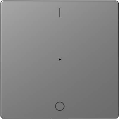 Grå kvadratisk tryckomkopplare med minimalistisk design, central punkt och liten cirkel nedtill, lämplig för modern inredning.