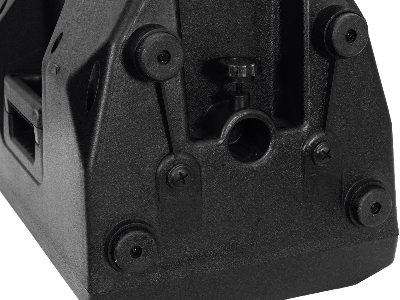 Svart plastinkapsling med fyra runda fötter och en central justeringsskruv.