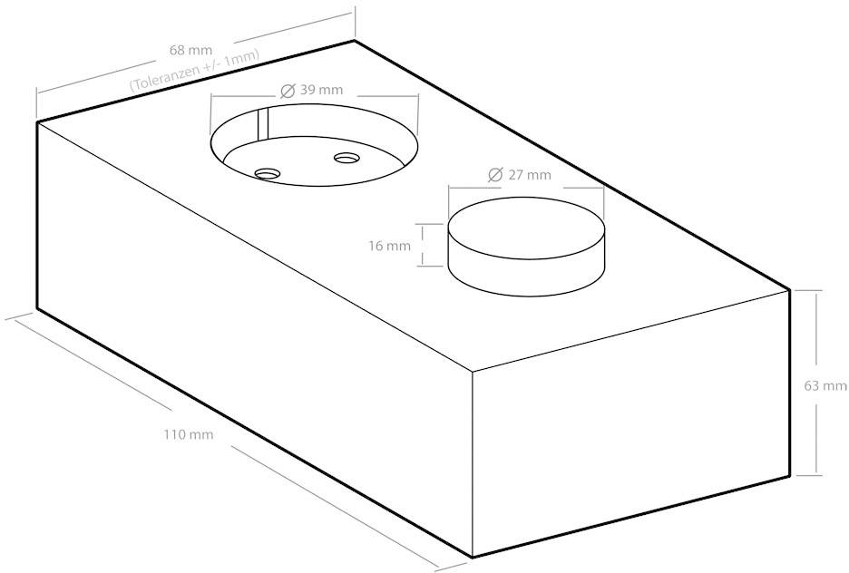 Teknisk ritning av en rektangulär block med hål: Vänster en 39 mm diameter förstoring, höger en 27 mm fördjupning.