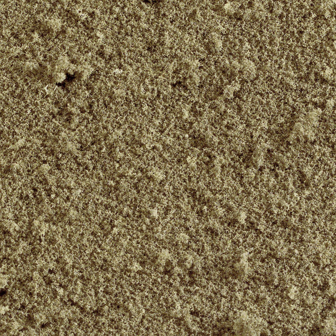 Närbild av en beige mattstruktur med tät, jämn yta. Fibrerna är tätt sammanvävda.