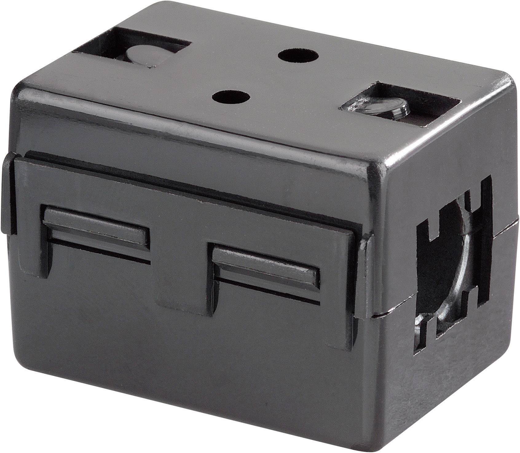 Svart plastholje med hål och öppningar, rektangulär form, möjligen avsett för elektroniska komponenter.