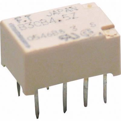 En liten elektronisk komponent med sex metallben. Påtryckt 'F T JAPAN B3CBA-57' och sifferserien '054693 3 S'.