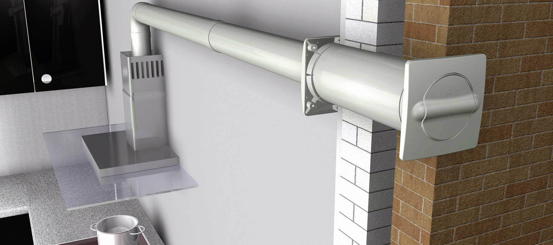 Köksfläkt med ventilationsrör som leder genom en vägg. Visar installationen av en köksventilationslösning.