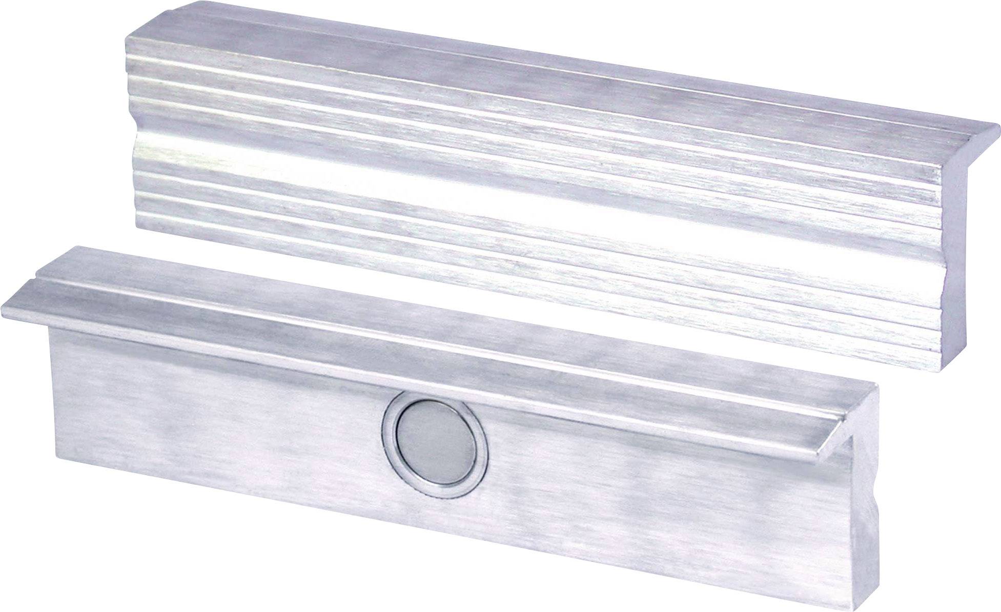 Två silvermetallblock med räfflad yta; ett har ett cirkulärt element i mitten. De ligger bredvid varandra.