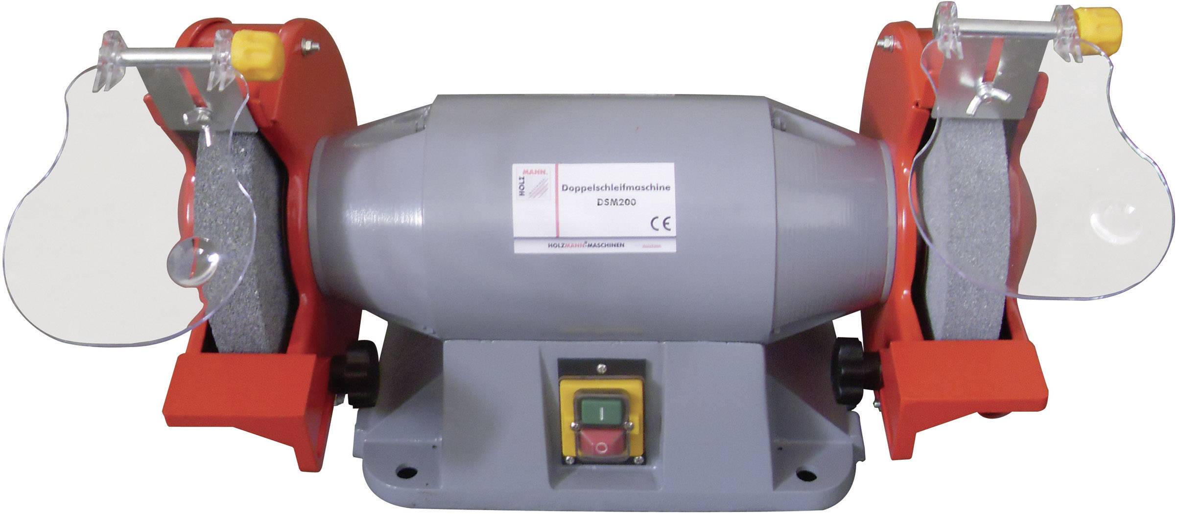 Grå dubbelslipmaskin med två roterande slipskivor, skyddsöverdrag och gul strömbrytare monterad mitt på ett bord.