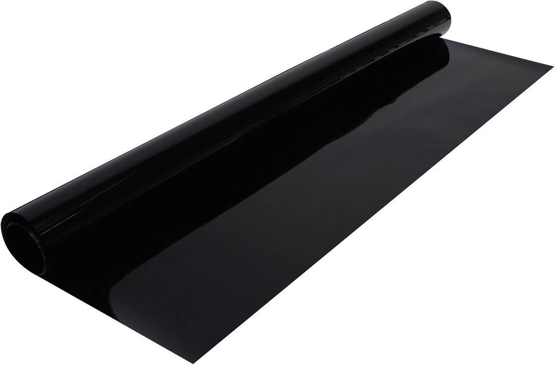 En rulle svart folie, utrullad på en plan yta, perfekt för blank ytbeläggning eller som skyddsmaterial.