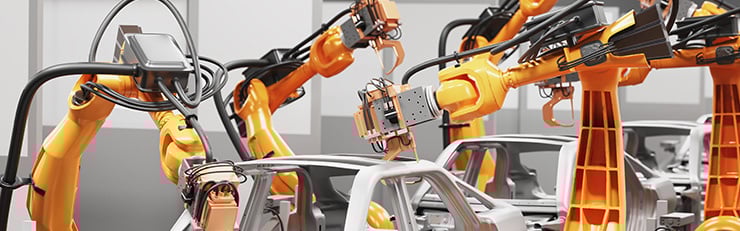 Roboterarme arbeiten synchron an der Montage von Fahrzeugkarosserien in einer automatisierten Fertigungslinie.