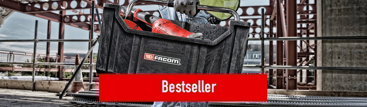 Das Bild zeigt eine Person, die eine Werkzeugbox von FACOM trägt, während sie sich auf einer Baustelle bewegt. Bei Klick auf das Bild werden die Facom Bestseller aufgerufen.