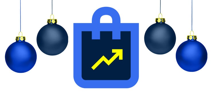 Ein Icon einer Tasche sitzt inmitten von blauen Weihnachtskugeln