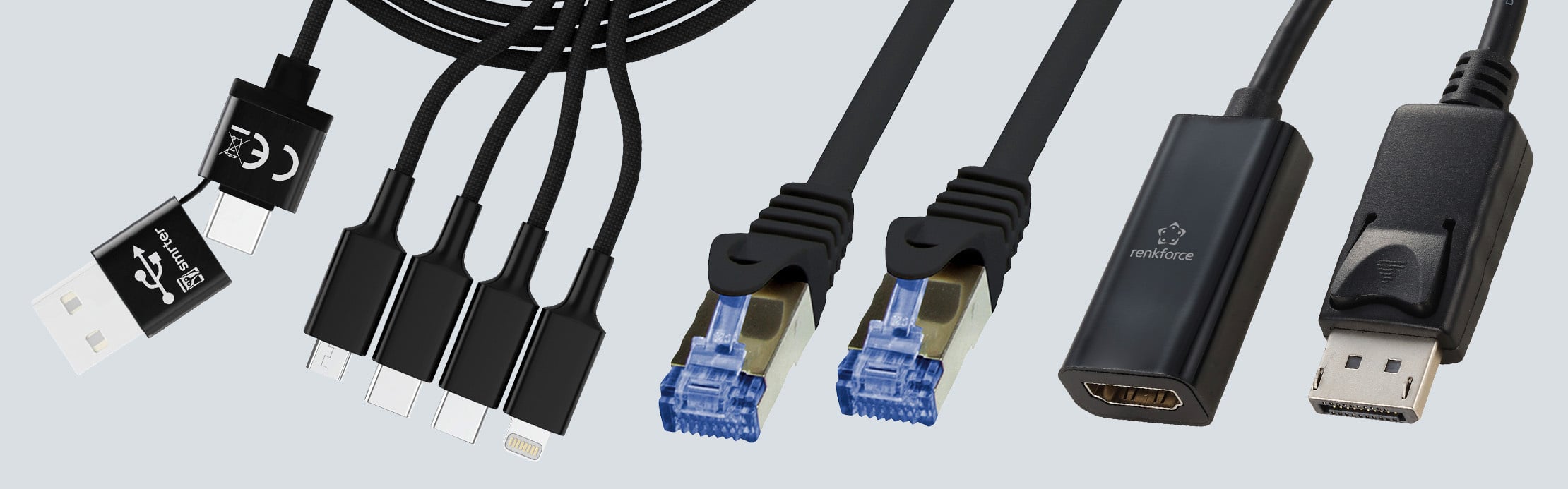 Verschiedene schwarze PC-Kabel und Adapter mit USB-, Netzwerk-, HDMI- und DisplayPort-Anschlüssen.
