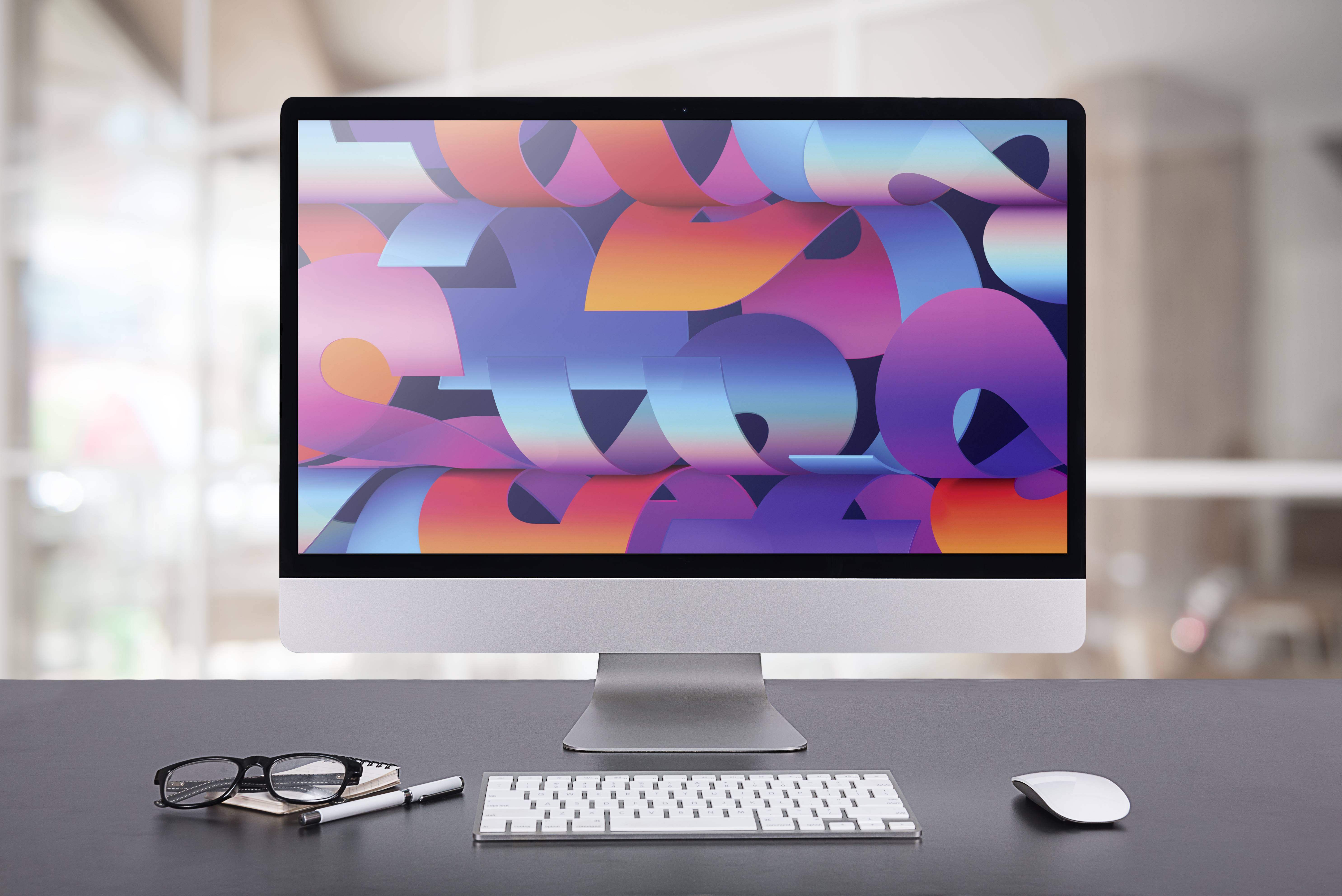 Auf diesem Bild sieht man ein Display von Apple mit der passenden Maus und Tastatur.