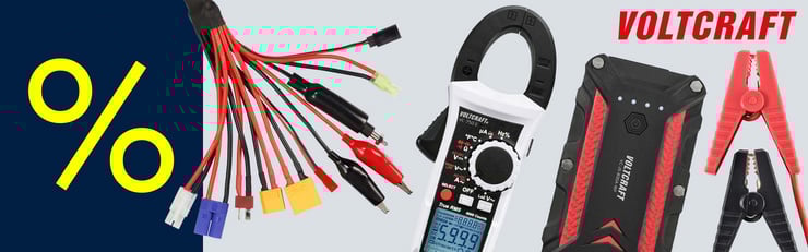 Produits de mesure et accessoires VOLTCRAFT tels que des câbles adaptateurs, une pince ampèremétrique, un booster de démarrage et des pinces de batterie à côté d’un symbole de pourcentage sur fond clair.