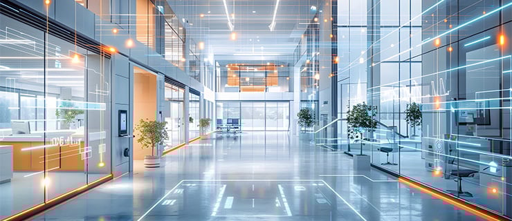 Bureau avec façades vitrées et superpositions numériques qui visualisent l'utilisation de capteurs IoT pour le contrôle intelligent de la climatisation, de l'énergie et de l'éclairage.