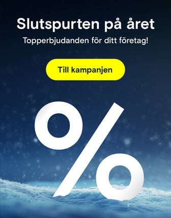 En stor, vit procentskylt står i snön under texten "Årsavslutningskampanj" och "Topp erbjudanden för ditt företag!"
